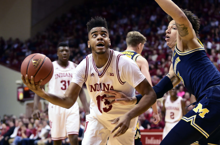 Feb 12, 2017; Bloomington, IN, USA; Indiana Hoosiers forward Juwan Morgan (13) attempts to shoot past Michigan Wolverines forward D.J. Wilson (5) during the first half at Assembly Hall. Mandatory Credit: Marc Lebryk-USA TODAY Sports