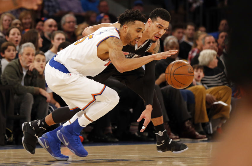Feb 12, 2017; New York, NY, USA; New York Knicks guard Courtney Lee (5) battles for a loose ball with San Antonio Spurs guard Danny Green (14) during the second quarter at Madison Square Garden. Mandatory Credit: Adam Hunger-USA TODAY Sports