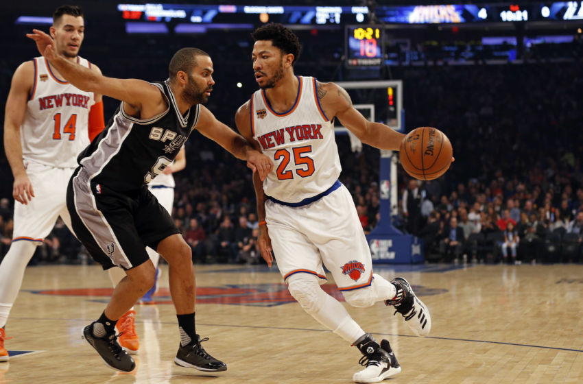 Feb 12, 2017; New York, NY, USA; New York Knicks guard Derrick Rose (25) drives to the basket past San Antonio Spurs guard Tony Parker (9) during the first quarter at Madison Square Garden. Mandatory Credit: Adam Hunger-USA TODAY Sports