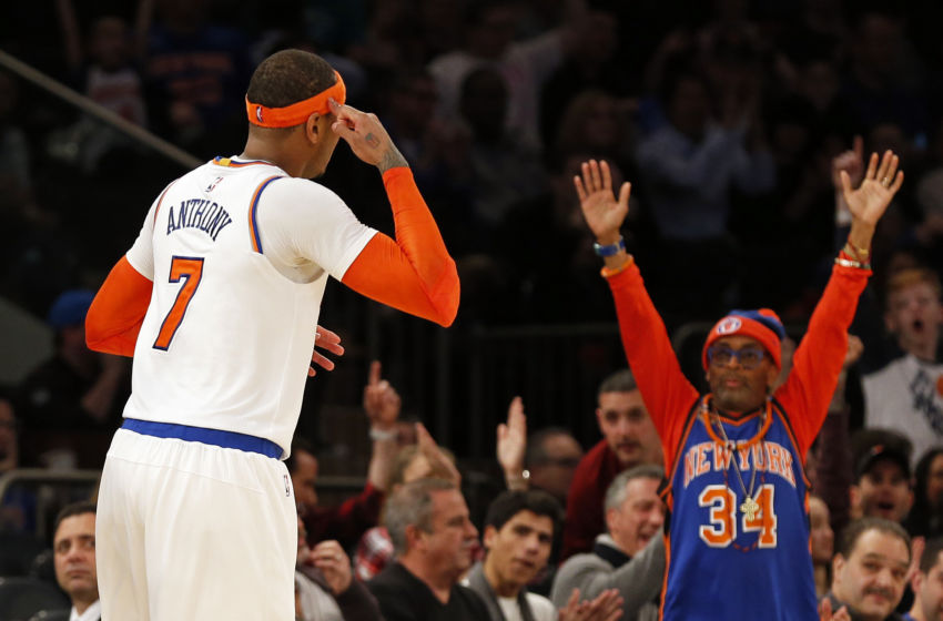 Feb 12, 2017; New York, NY, USA; New York Knicks forward Carmelo Anthony (7) reacts after hitting a three-point basket along with director Spike Lee during the second half against the San Antonio Spurs at Madison Square Garden. Mandatory Credit: Adam Hunger-USA TODAY Sports