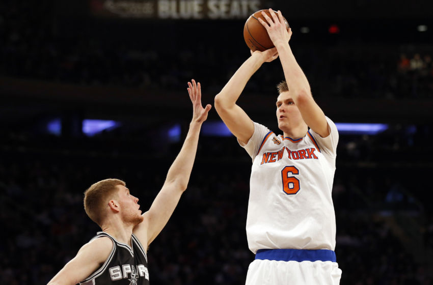 Feb 12, 2017; New York, NY, USA; New York Knicks forward Kristaps Porzingis (6) shoots over San Antonio Spurs forward Davis Bertans (42) during the second quarter at Madison Square Garden. Mandatory Credit: Adam Hunger-USA TODAY Sports
