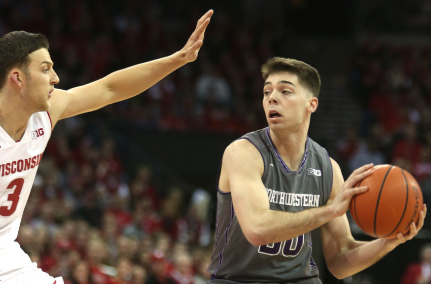 Feb 12, 2017; Madison, WI, USA; Northwestern Wildcats guard Bryant McIntosh looks to pass over Wisconsin Badgers guard Zak Showalter (3) at the Kohl Center. Mandatory Credit: Mary Langenfeld-USA TODAY Sports