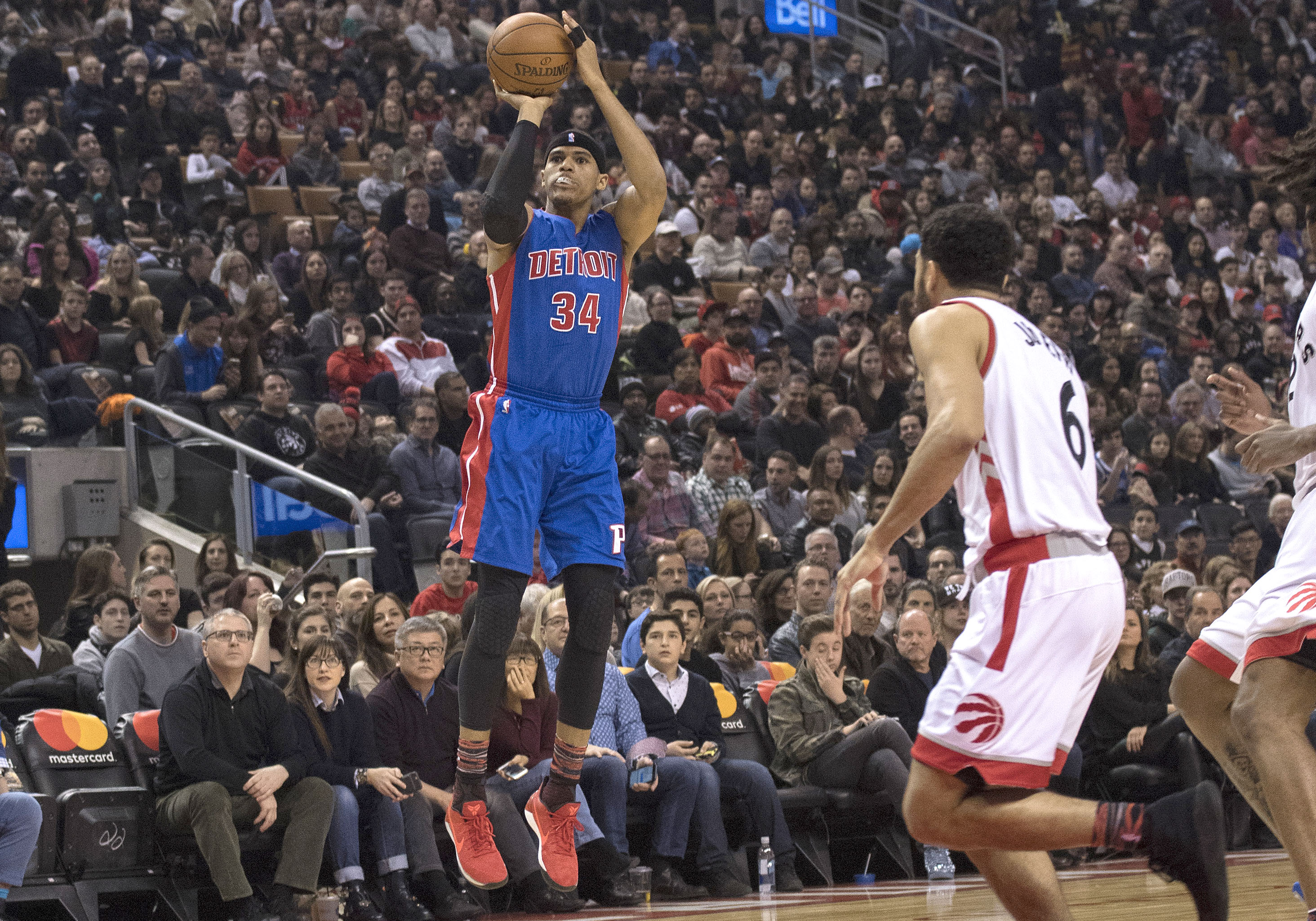 Feb 12, 2017; Toronto, Ontario, CAN; Detroit Pistons forward Tobias Harris (34) shoots a ball at the basket over Toronto Raptors guard Cory Joseph (6) during the first quarter in a game at Air Canada Centre.The Pistons won 102-101. Mandatory Credit: Nick Turchiaro-USA TODAY Sports