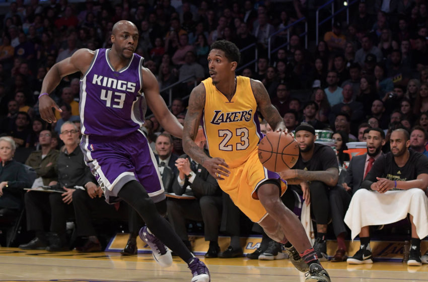 Feb 14, 2017; Los Angeles, CA, USA; Los Angeles Lakers guard Lou Williams (23) moves to the basket against Sacramento Kings forward Anthony Tolliver (43) during the first half at Staples Center. Mandatory Credit: Kirby Lee-USA TODAY Sports