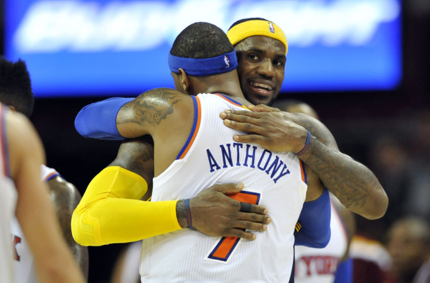 Oct 30, 2014; Cleveland, OH, USA; Cleveland Cavaliers forward LeBron James (back) hugs New York Knicks forward Carmelo Anthony (7) after the Knicks' 95-90 win over the Cavaliers at Quicken Loans Arena. Mandatory Credit: David Richard-USA TODAY Sports