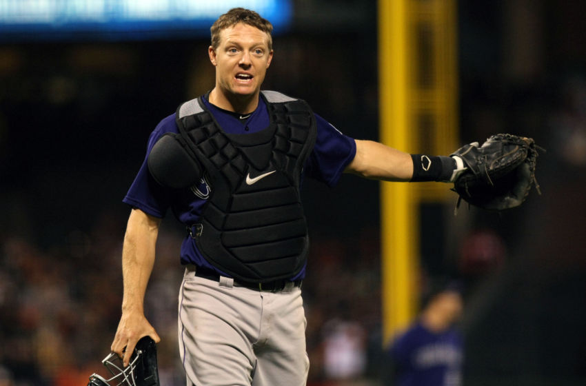 Apr 14, 2015; San Francisco, CA, USA; Colorado Rockies catcher Nick Hundley (4) questions a call that allowed San Francisco Giants center fielder Angel Pagan (not pictured) to tag up and advance to third base in the eighth inning of their MLB baseball game at AT&T Park. Mandatory Credit: Lance Iversen-USA TODAY Sports. Rockies won 4-1.