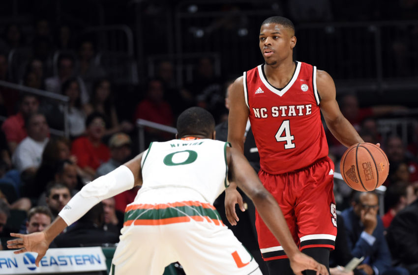 Dec 31, 2016; Coral Gables, FL, USA; North Carolina State Wolfpack guard Dennis Smith Jr. (4) dribbles the ball against Miami Hurricanes guard Ja'Quan Newton (0) during the first half at Watsco Center. Mandatory Credit: Steve Mitchell-USA TODAY Sports