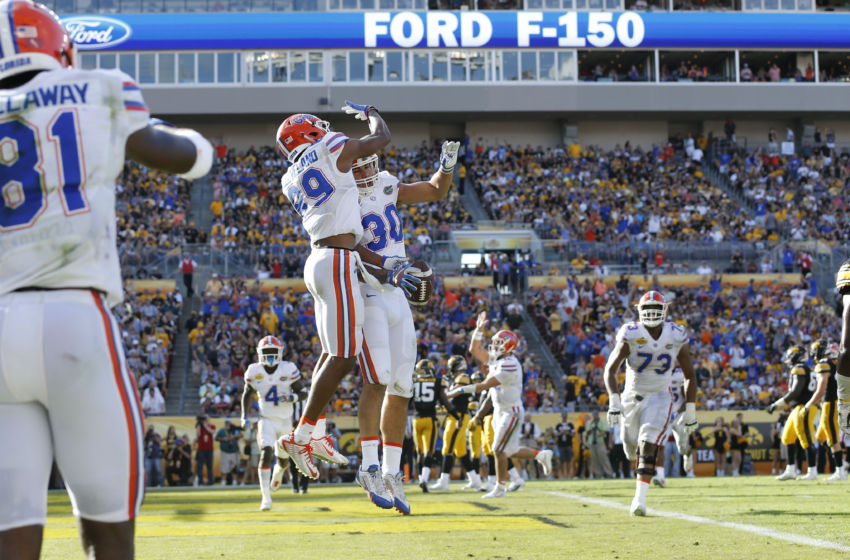 Jan 2, 2017; Tampa , FL, USA; Florida Gators tight end DeAndre Goolsby (30) celebrates with teammates after a touchdown catch against the Iowa Hawkeyes during the second half at Raymond James Stadium. The Gators won 30-3. Mandatory Credit: Kim Klement-USA TODAY Sports