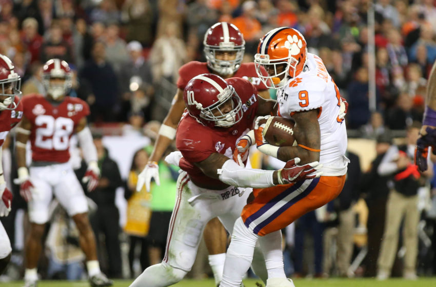 December 31, 2016; Glendale, AZ, USA; Ohio State Buckeyes cornerback Marshon Lattimore (2) tackles Clemson Tigers quarterback Deshaun Watson (4) in the 2016 CFP semifinal at University of Phoenix Stadium. Mandatory Credit: Mark J. Rebilas-USA TODAY Sports