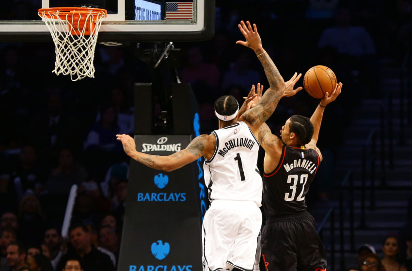 Jan 15, 2017; Brooklyn, NY, USA; Houston Rockets forward K.J.McDaniels (32) shoots the ball against Brooklyn Nets forward Chris McCullough (1) during the second half at Barclays Center. The Rockets won 137-112. Mandatory Credit: Andy Marlin-USA TODAY Sports