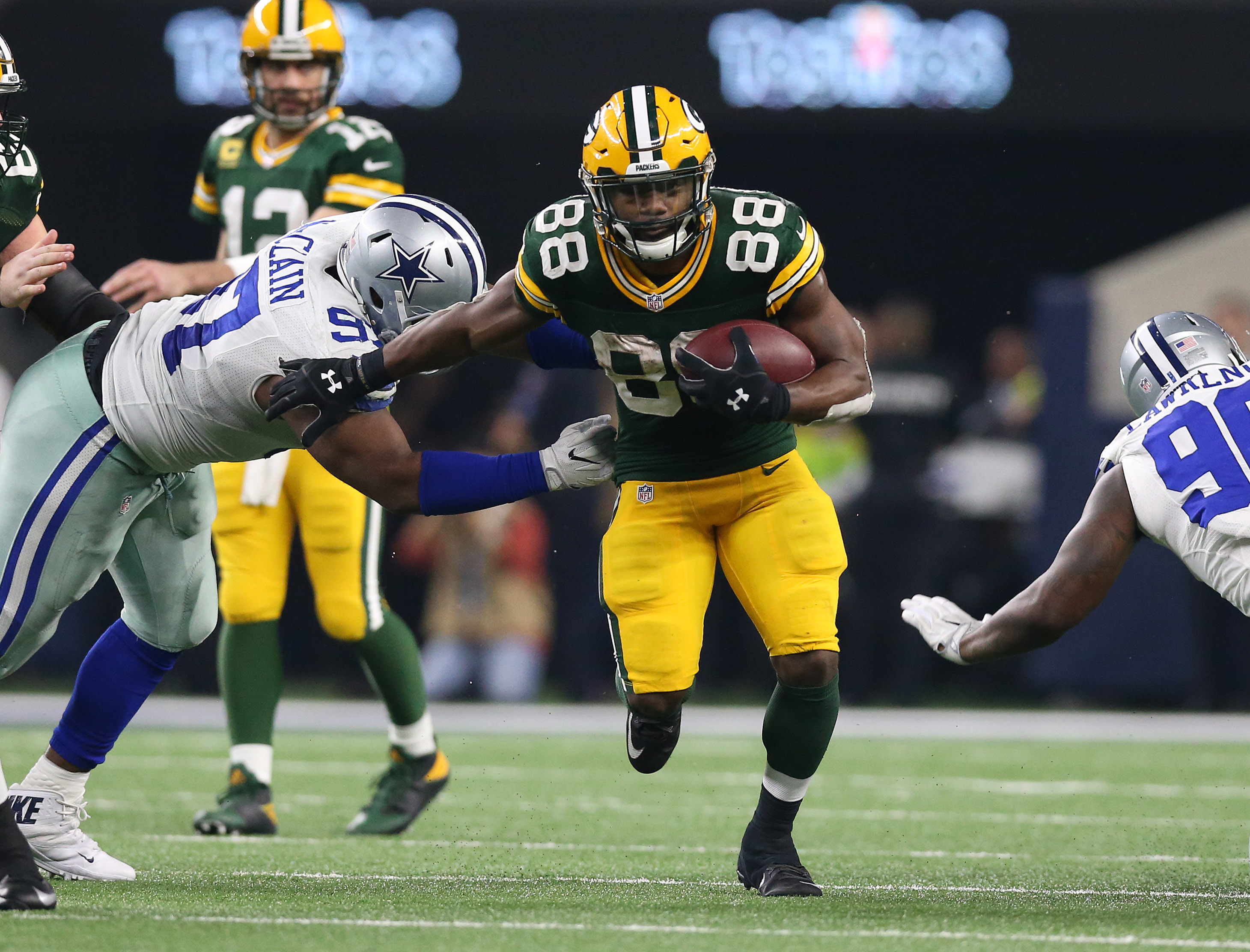 Green Bay Packers running back Ty Montgomery stiff arms against Dallas Cowboys defensive tackle Terrell McClain in the NFC Divisional playoff game at AT&T Stadium. Matthew Emmons-USA TODAY Sports