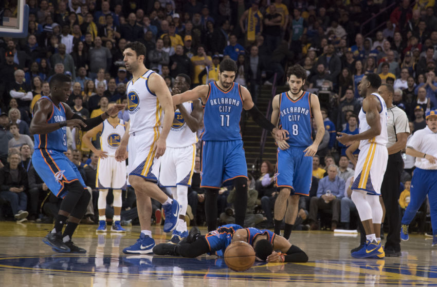 January 18, 2017; Oakland, CA, USA; Golden State Warriors center Zaza Pachulia (27) fouls Oklahoma City Thunder guard Russell Westbrook (0) receiving a flagrant foul during the second quarter at Oracle Arena. Mandatory Credit: Kyle Terada-USA TODAY Sports