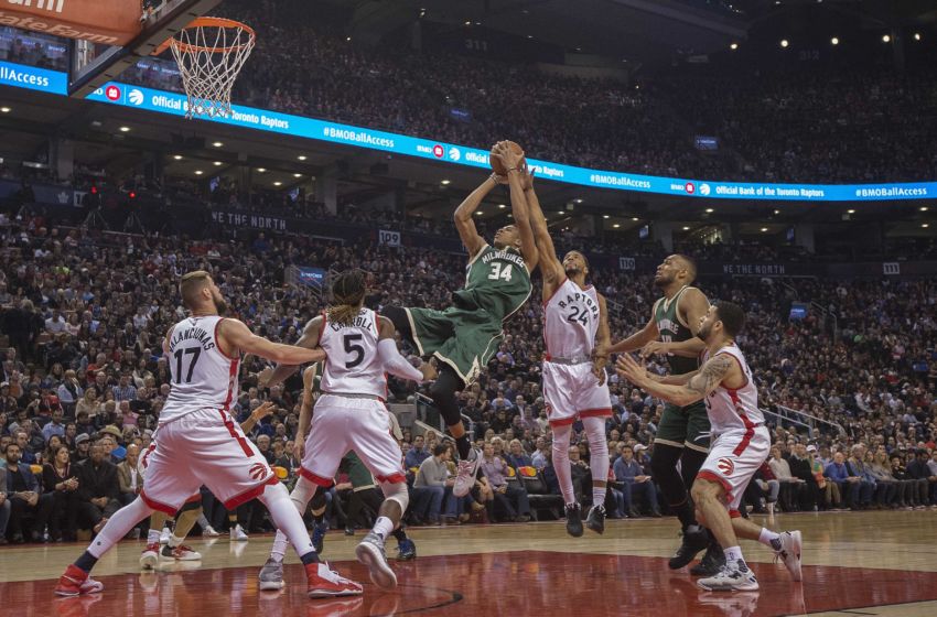 Jan 27, 2017; Toronto, Ontario, CAN; Milwaukee Bucks forward Giannis Antetokounmpo (34) takes a shot at the basket as Toronto Raptors guard Norman Powell (24) tries to defend during the second quarter in a game at Air Canada Centre. Mandatory Credit: Nick Turchiaro-USA TODAY Sports