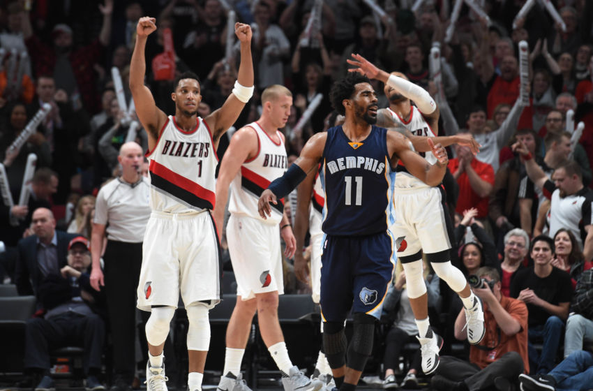 Jan 27, 2017; Portland, OR, USA; Memphis Grizzlies guard Mike Conley (11) reacts after missing a shot at the end of the game as Portland Trail Blazers guard Evan Turner (1), center Mason Plumlee (24) and guard Damian Lillard (0) celebrate in the background at the Moda Center. The Blazers won the game 112-109. Mandatory Credit: Steve Dykes-USA TODAY Sports