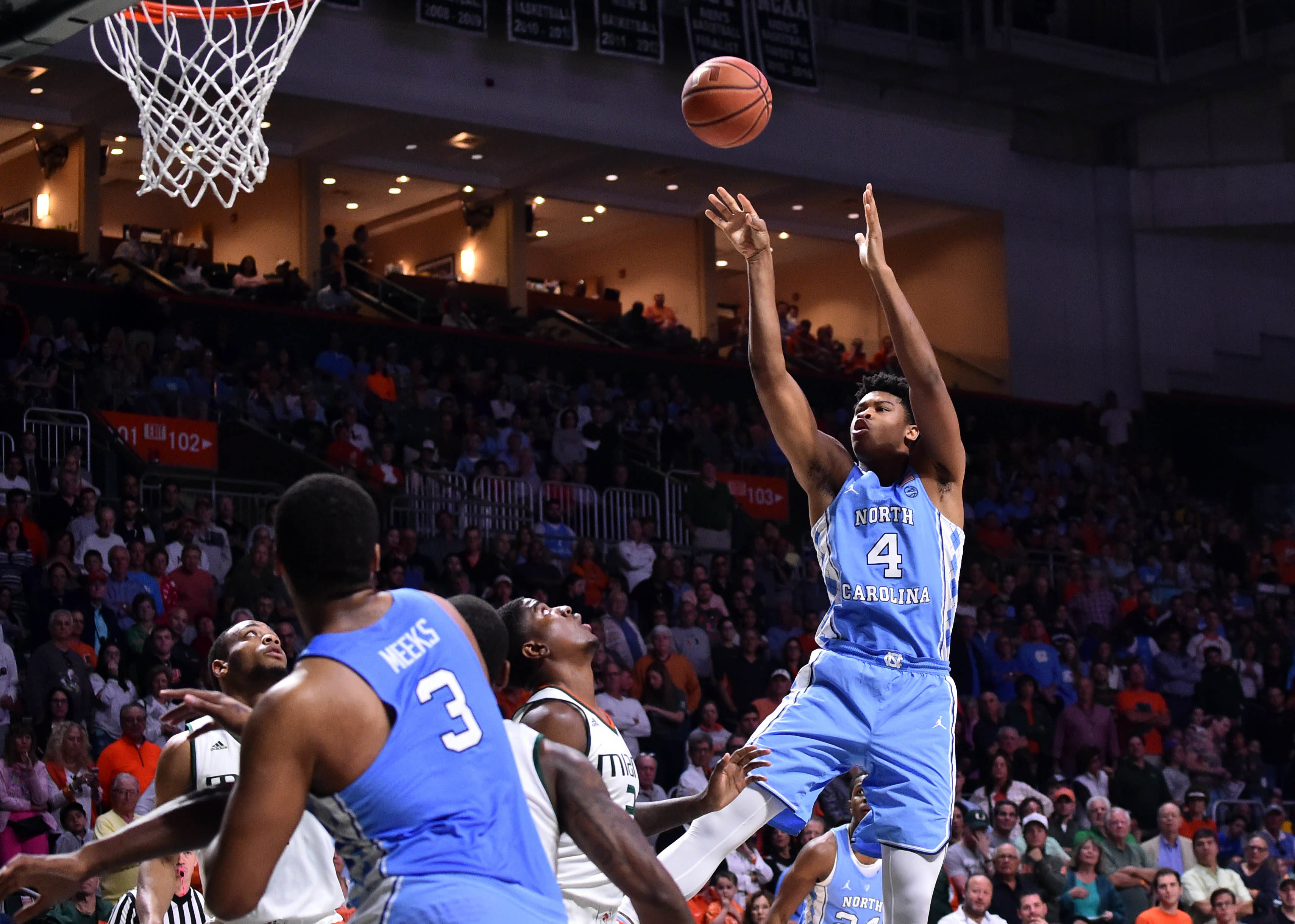 Jan 28, 2017; Coral Gables, FL, USA; North Carolina Tar Heels forward Kennedy Meeks (3) shoots over Miami Hurricanes forward Anthony Lawrence Jr. (3) during the first half at Watsco Center. Mandatory Credit: Steve Mitchell-USA TODAY Sports