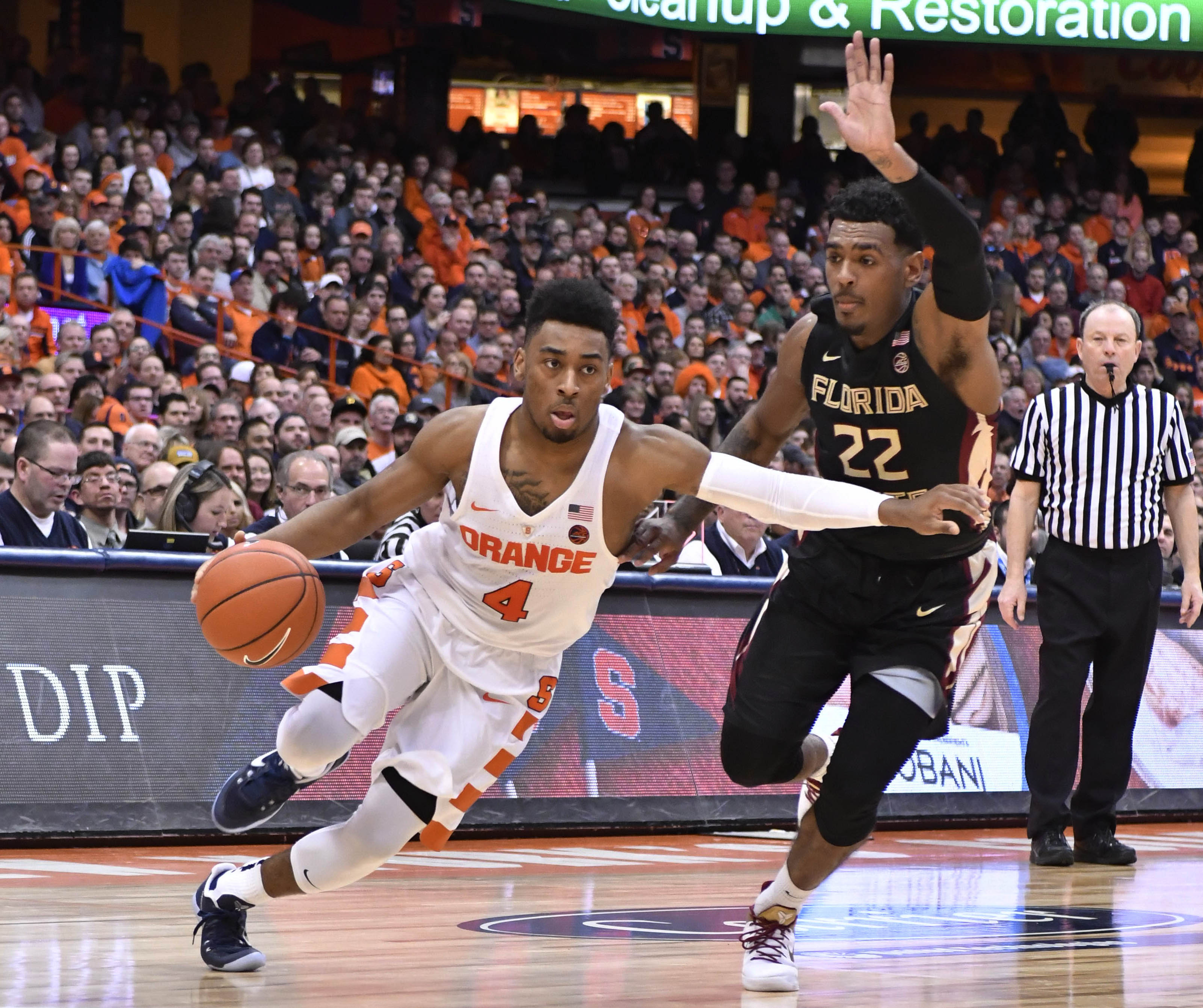 Jan 28, 2017; Syracuse, NY, USA; Syracuse Orange guard John Gillon (4) drives the ball past Florida State Seminoles guard Xavier Rathan-Mayes (22) during the second half of a game at the Carrier Dome. Syracuse won the contest 82-72. Mandatory Credit: Mark Konezny-USA TODAY Sports