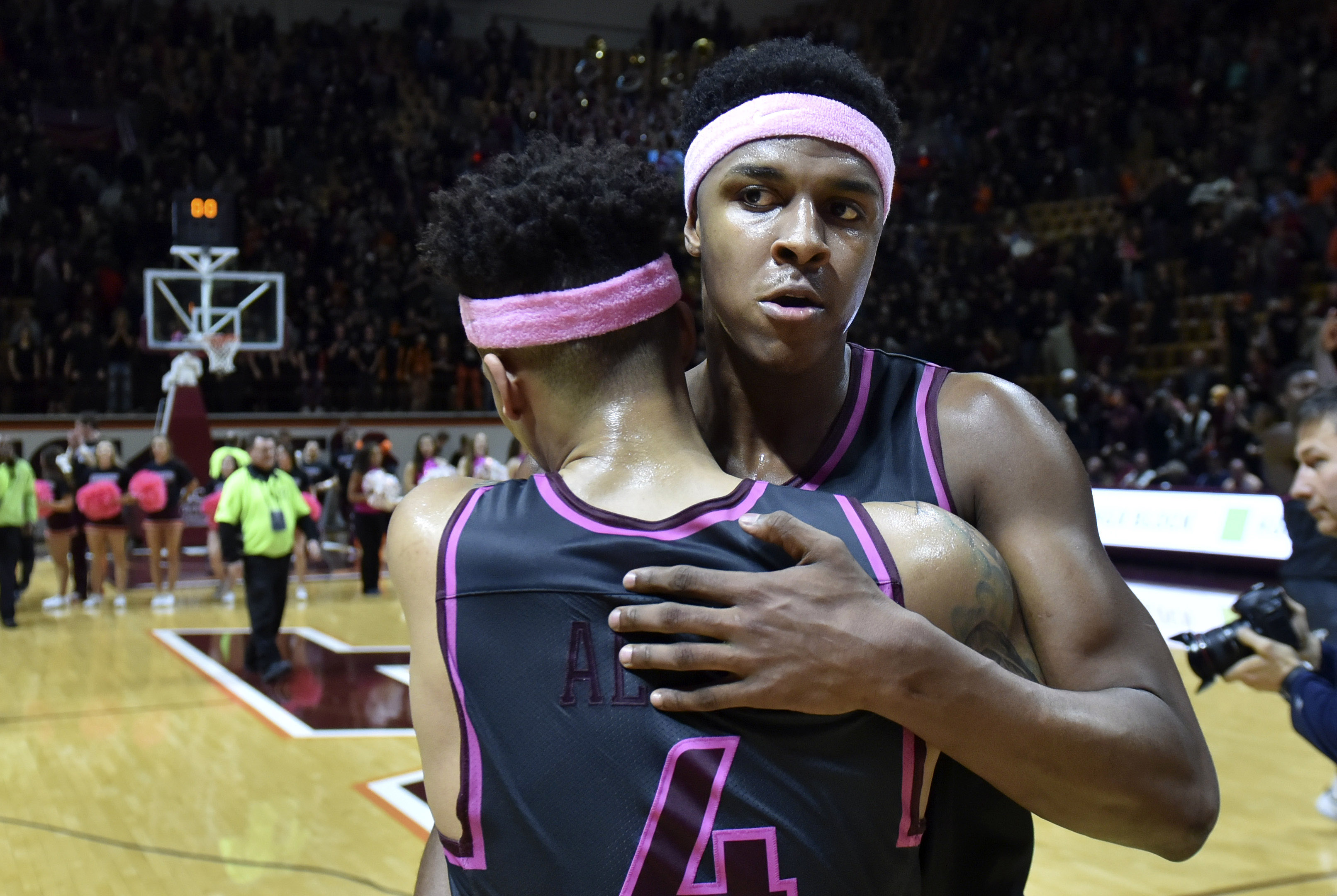 Jan 29, 2017; Blacksburg, VA, USA; Virginia Tech Hokies guard Seth Allen (4) is hugged by forward Zach LeDay (32) following the victory against the Boston College Eagles at Cassell Coliseum. Mandatory Credit: Michael Shroyer-USA TODAY Sports