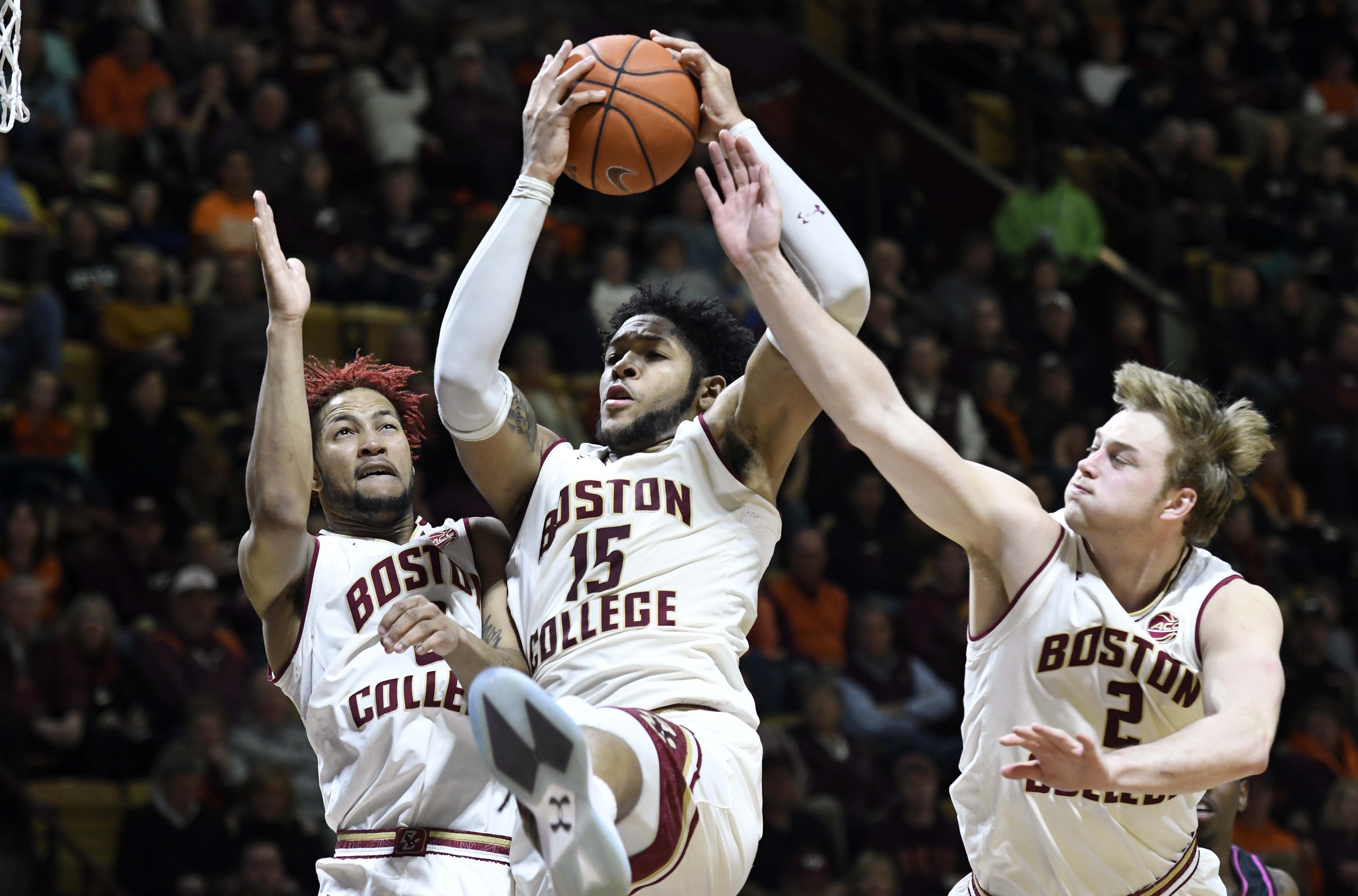 Jan 29, 2017; Blacksburg, VA, USA; Boston College Eagles forward Mo Jeffers (15) beats teammates guard Ky Bowman (0) and forward Connar Tava (2) to the rebound in the second half against the Virginia Tech Hokies at Cassell Coliseum. Mandatory Credit: Michael Shroyer-USA TODAY Sports