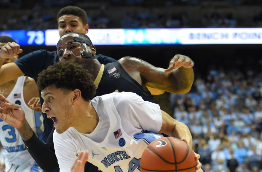 Jan 31, 2017; Chapel Hill, NC, USA; North Carolina Tar Heels forward Justin Jackson (44) drives to the basket as Pittsburgh Panthers forward Michael Young (2) defends in the second half. The Tar Heels defeated the Panthers 80-78 at Dean E. Smith Center. Mandatory Credit: Bob Donnan-USA TODAY Sports