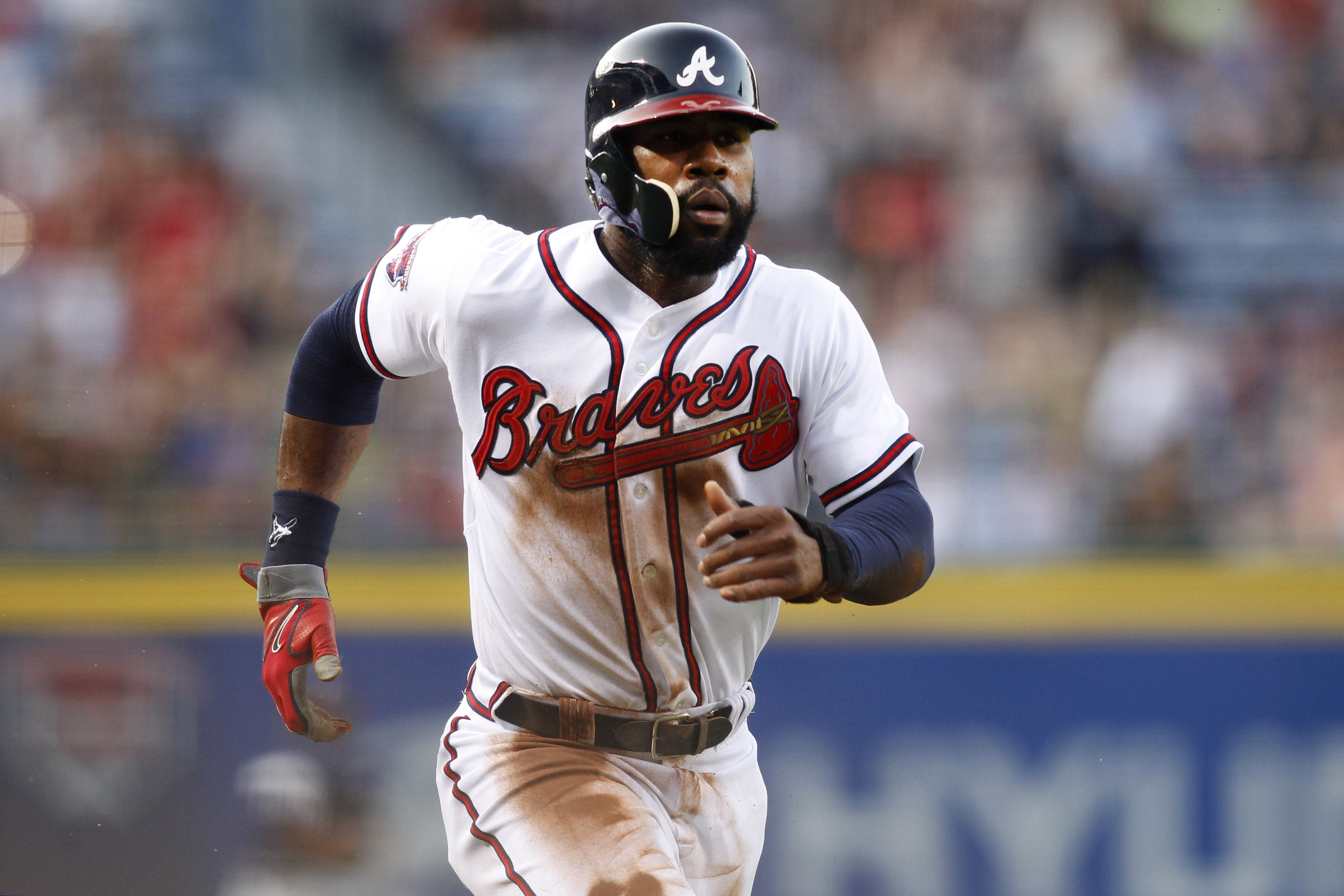 May 19, 2014; Atlanta, GA, USA; Atlanta Braves right fielder Jason Heyward (22) scores a run against the Milwaukee Brewers in the first inning at Turner Field. Mandatory Credit: Brett Davis-USA TODAY Sports