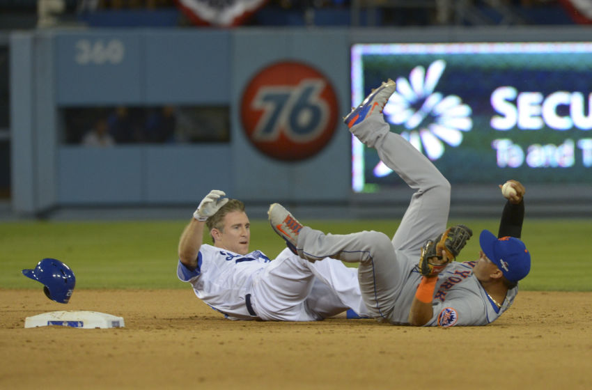 Oct 10, 2015; Los Angeles, CA, USA; New York Mets shortstop Ruben Tejada (right) collides with Los Angeles Dodgers second baseman Chase Utley (left) at second base during the seventh inning in game two of the NLDS at Dodger Stadium. Mandatory Credit: Jayne Kamin-Oncea-USA TODAY Sports