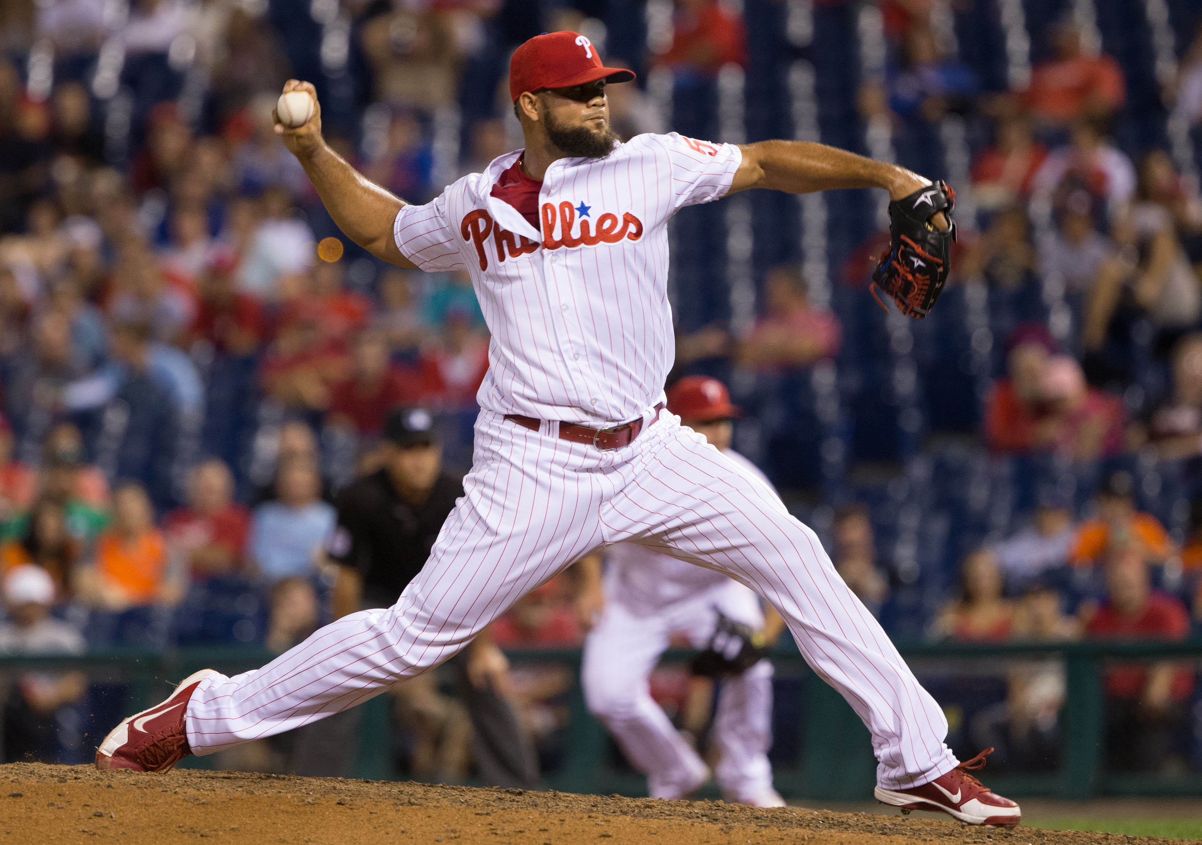 Aug 3, 2016; Philadelphia, PA, USA; Philadelphia Phillies relief pitcher Luis Garcia (57) pitches during the twelfth inning against the San Francisco Giants at Citizens Bank Park. The Philadelphia Phillies won 5-4 in the twelfth inning. Mandatory Credit: Bill Streicher-USA TODAY Sports