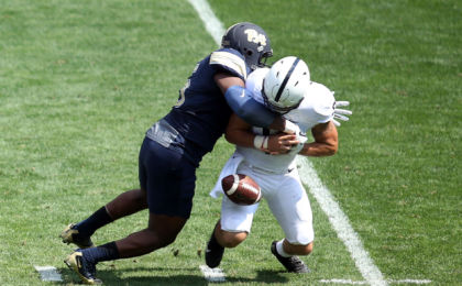 Sep 10, 2016; Pittsburgh, PA, USA; Pittsburgh Panthers defensive lineman Ejuan Price (L) causes Penn State Nittany Lions quarterback Trace McSorley (9) to fumble during the second quarter at Heinz Field. Mandatory Credit: Charles LeClaire-USA TODAY Sports