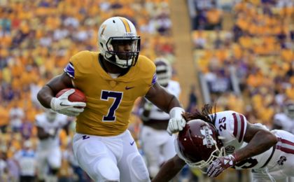 Sep 17, 2016; Baton Rouge, LA, USA; LSU Tigers running back Leonard Fournette (7) is defended by Mississippi State Bulldogs defensive back Lashard Durr (25) during the first quarter of a game at Tiger Stadium. Mandatory Credit: Derick E. Hingle-USA TODAY Sports