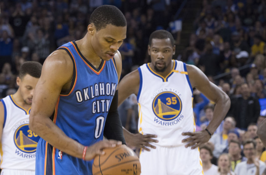 November 3, 2016; Oakland, CA, USA; Oklahoma City Thunder guard Russell Westbrook (0) shoots a technical foul shot as Golden State Warriors forward Kevin Durant (35) looks on during the second quarter at Oracle Arena. Mandatory Credit: Kyle Terada-USA TODAY Sports