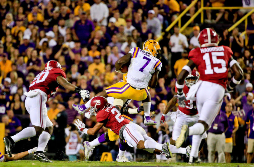 Nov 5, 2016; Baton Rouge, LA, USA; LSU Tigers running back Leonard Fournette (7) leaps over Alabama Crimson Tide defensive back Minkah Fitzpatrick (29) during the second quarter of a game at Tiger Stadium. Mandatory Credit: Derick E. Hingle-USA TODAY Sports