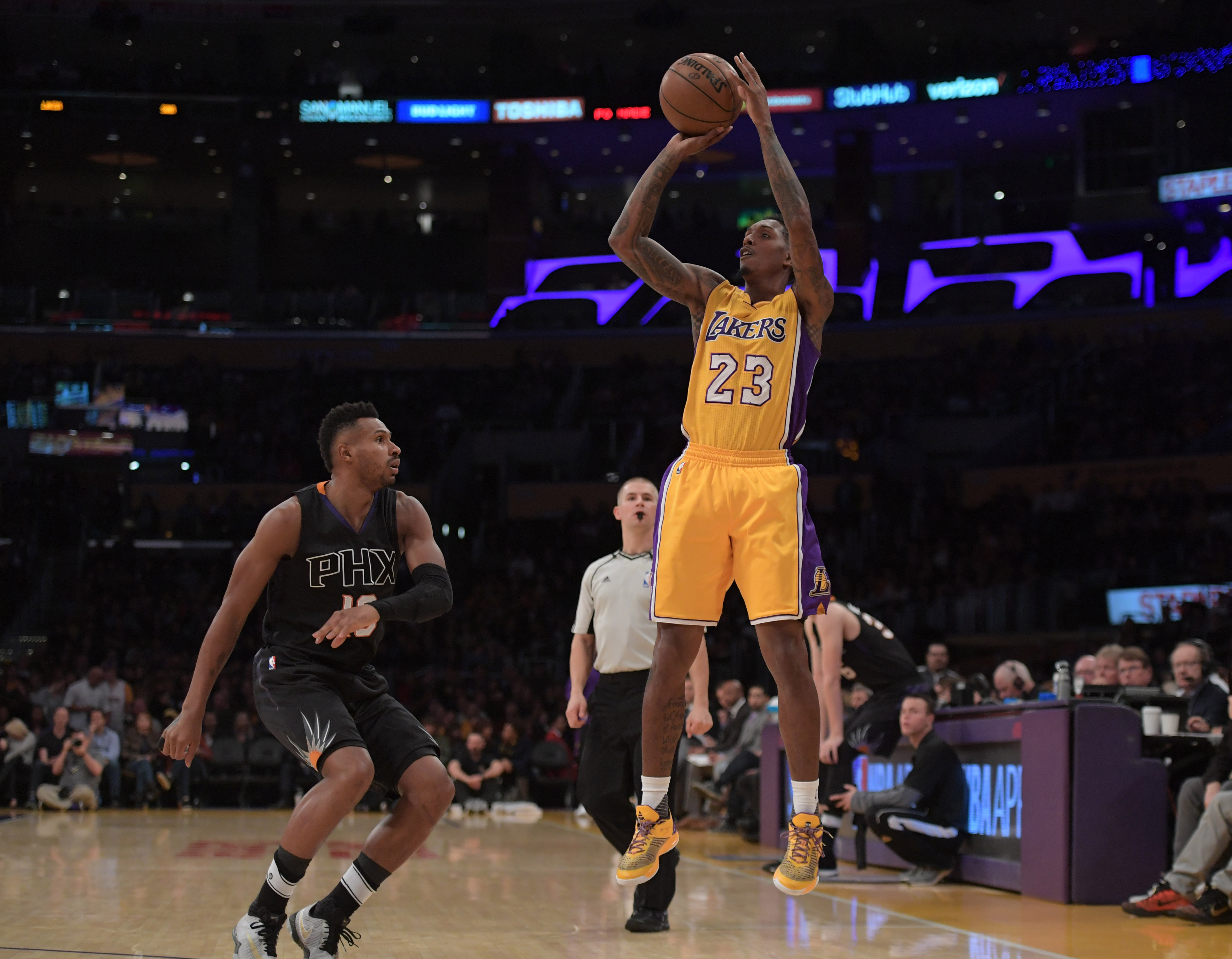 Dec 9, 2016; Los Angeles, CA, USA; Los Angeles Lakers guard Lou Williams (23) defended by Phoenix Suns forward Alan Williams (15) during a basketball game at Staples Center. Mandatory Credit: Kirby Lee-USA TODAY Sports