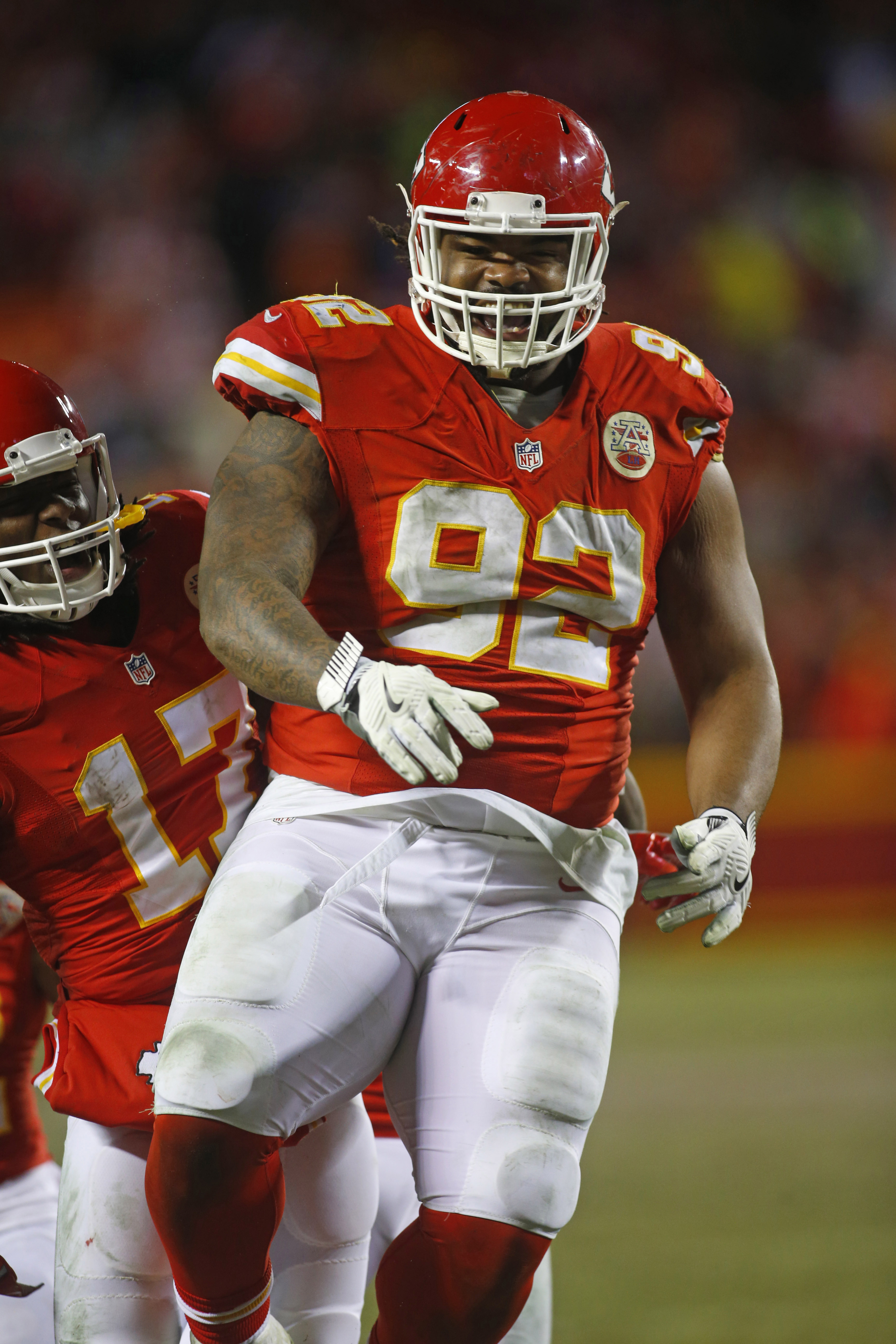 Dec 25, 2016; Kansas City, MO, USA; Kansas City Chiefs nose tackle Dontari Poe (92) is congratulated by wide receiver Chris Conley (17) after throwing a touchdown pass during the second half at Arrowhead Stadium. The Chiefs won 33-10. Mandatory Credit: Jay Biggerstaff-USA TODAY Sports