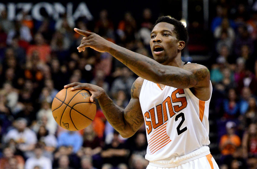 Dec 29, 2016; Phoenix, AZ, USA; Phoenix Suns guard Eric Bledsoe (2) points while dribbling the basketball up the court in the second half of the NBA game against the Toronto Raptors at Talking Stick Resort Arena. The Suns won 99-91. Mandatory Credit: Jennifer Stewart-USA TODAY Sports