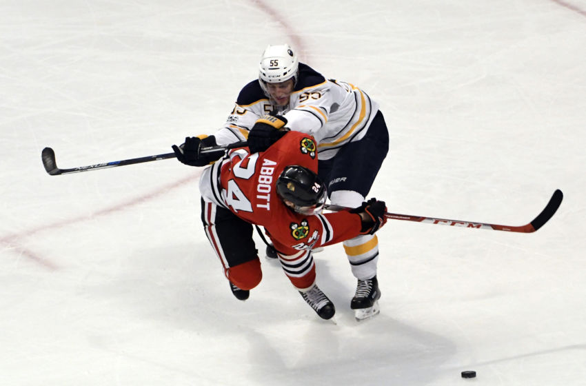 Jan 5, 2017; Chicago, IL, USA; Buffalo Sabres defenseman Rasmus Ristolainen (55) checks Chicago Blackhawks left wing Spencer Abbott (24) during the second period at the United Center. Mandatory Credit: David Banks-USA TODAY Sports