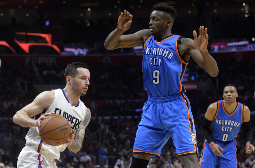 January 16, 2017; Los Angeles, CA, USA; Los Angeles Clippers guard J.J. Redick (4) moves the ball against Oklahoma City Thunder forward Jerami Grant (9) during the second half at Staples Center. Mandatory Credit: Gary A. Vasquez-USA TODAY Sports