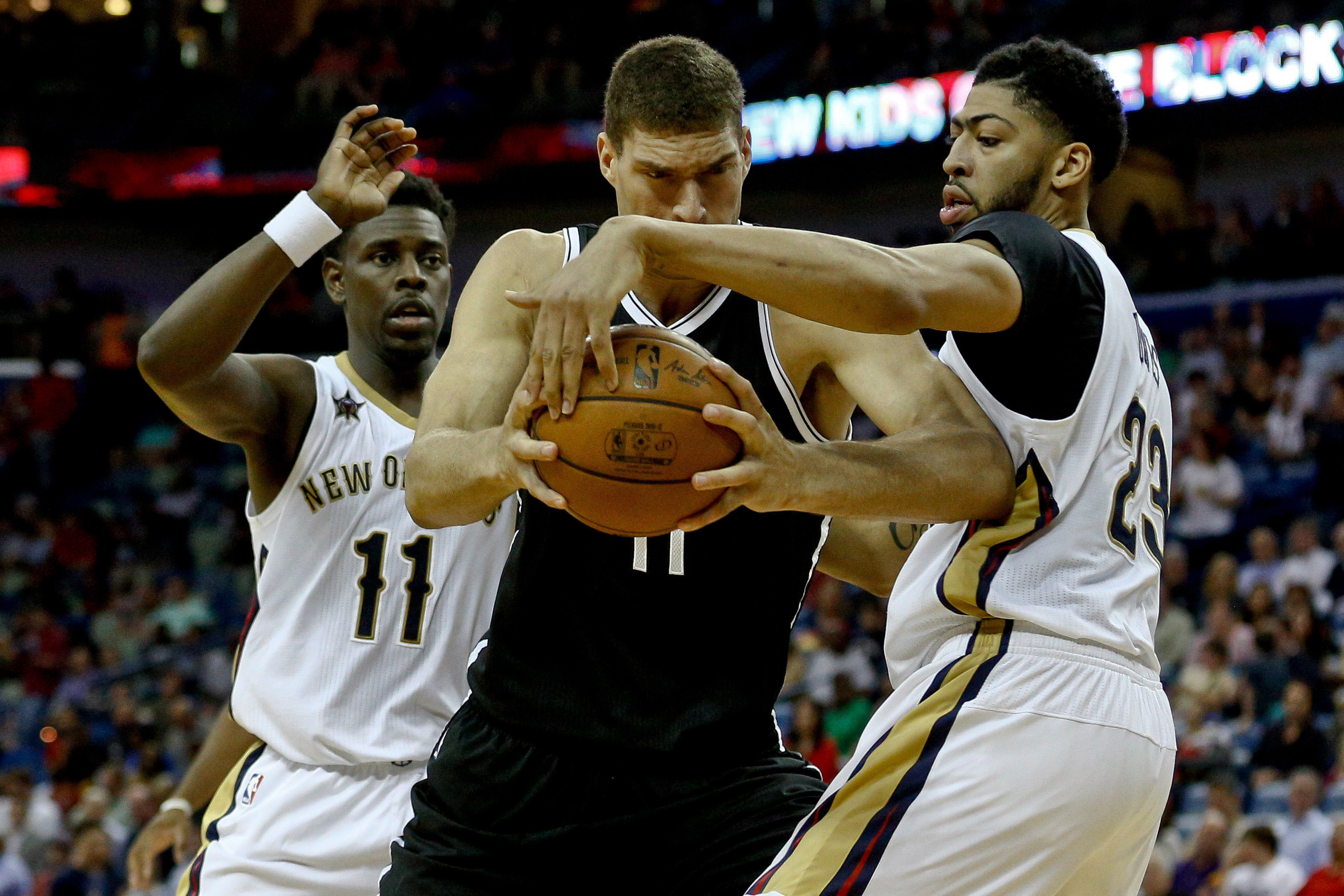 Jan 20, 2017; New Orleans, LA, USA; Brooklyn Nets center Brook Lopez (11) is defended by New Orleans Pelicans forward Anthony Davis (23) during the second half of a game at the Smoothie King Center. The Nets defeated the Pelicans 143-114. Mandatory Credit: Derick E. Hingle-USA TODAY Sports