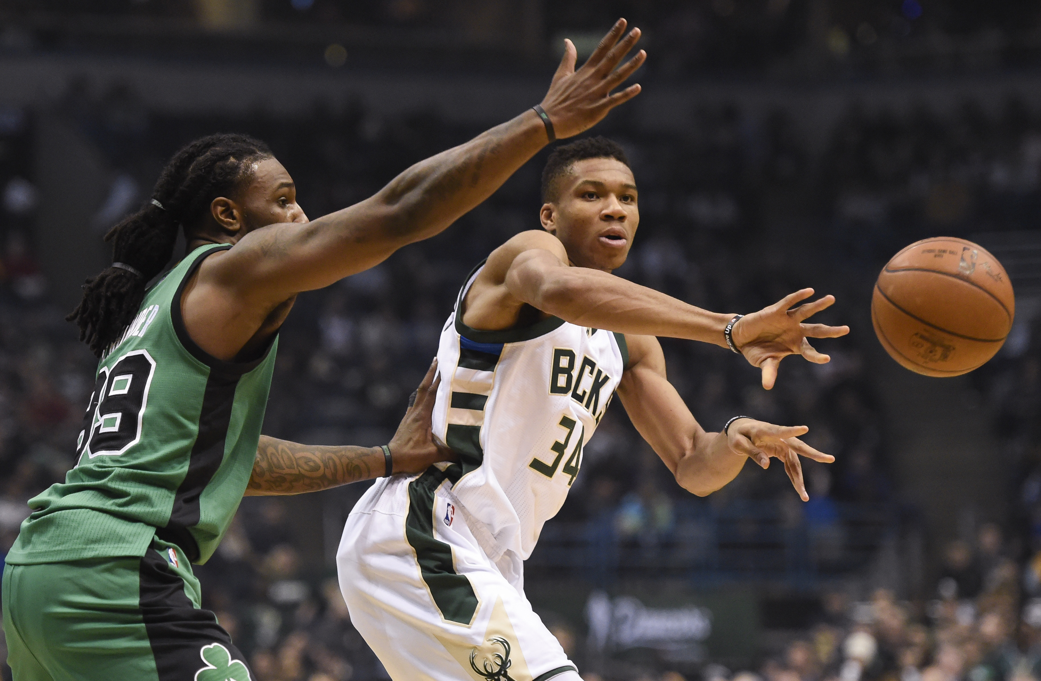 Jan 28, 2017; Milwaukee, WI, USA; Milwaukee Bucks forward Giannis Antetokounmpo (34) passes the ball away from Boston Celtics forward Jae Crowder (99) in the first quarter at BMO Harris Bradley Center. Mandatory Credit: Benny Sieu-USA TODAY Sports