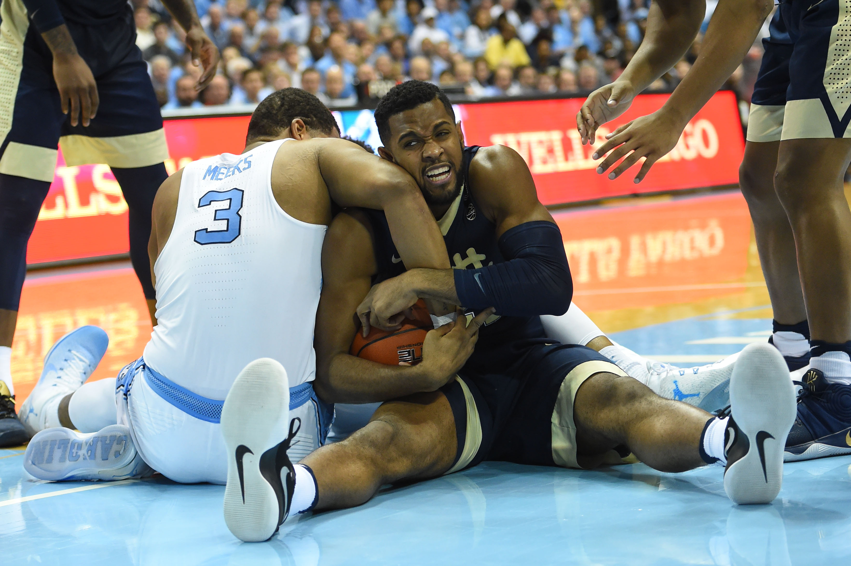 Jan 31, 2017; Chapel Hill, NC, USA; North Carolina Tar Heels forward Kennedy Meeks (3) and Pittsburgh Panthers forward Sheldon Jeter (21) fight for the ball in the second half. The Tar Heels defeated the Panthers 80-78 at Dean E. Smith Center. Mandatory Credit: Bob Donnan-USA TODAY Sports