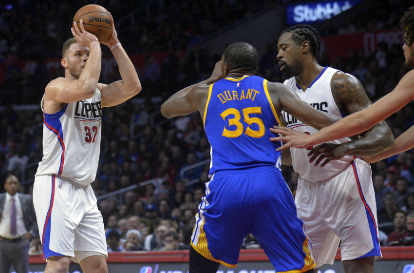 February 2, 2017; Los Angeles, CA, USA; Los Angeles Clippers forward Blake Griffin (32) shoots as center DeAndre Jordan (6) covers Golden State Warriors forward Kevin Durant (35) during the second half at Staples Center. Mandatory Credit: Gary A. Vasquez-USA TODAY Sports