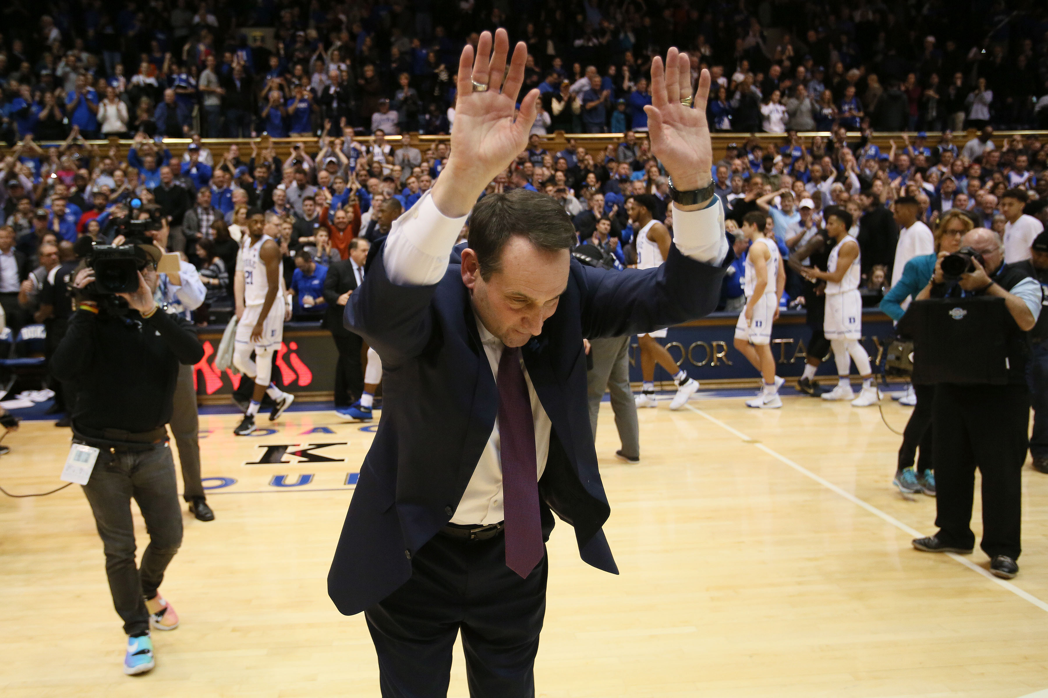 Feb 4, 2017; Durham, NC, USA; Duke Blue Devils head coach Mike Krzyzewski bows to the crowd after their 72-64 win over the Pittsburgh Panthers at Cameron Indoor Stadium. Mandatory Credit: Mark Dolejs-USA TODAY Sports