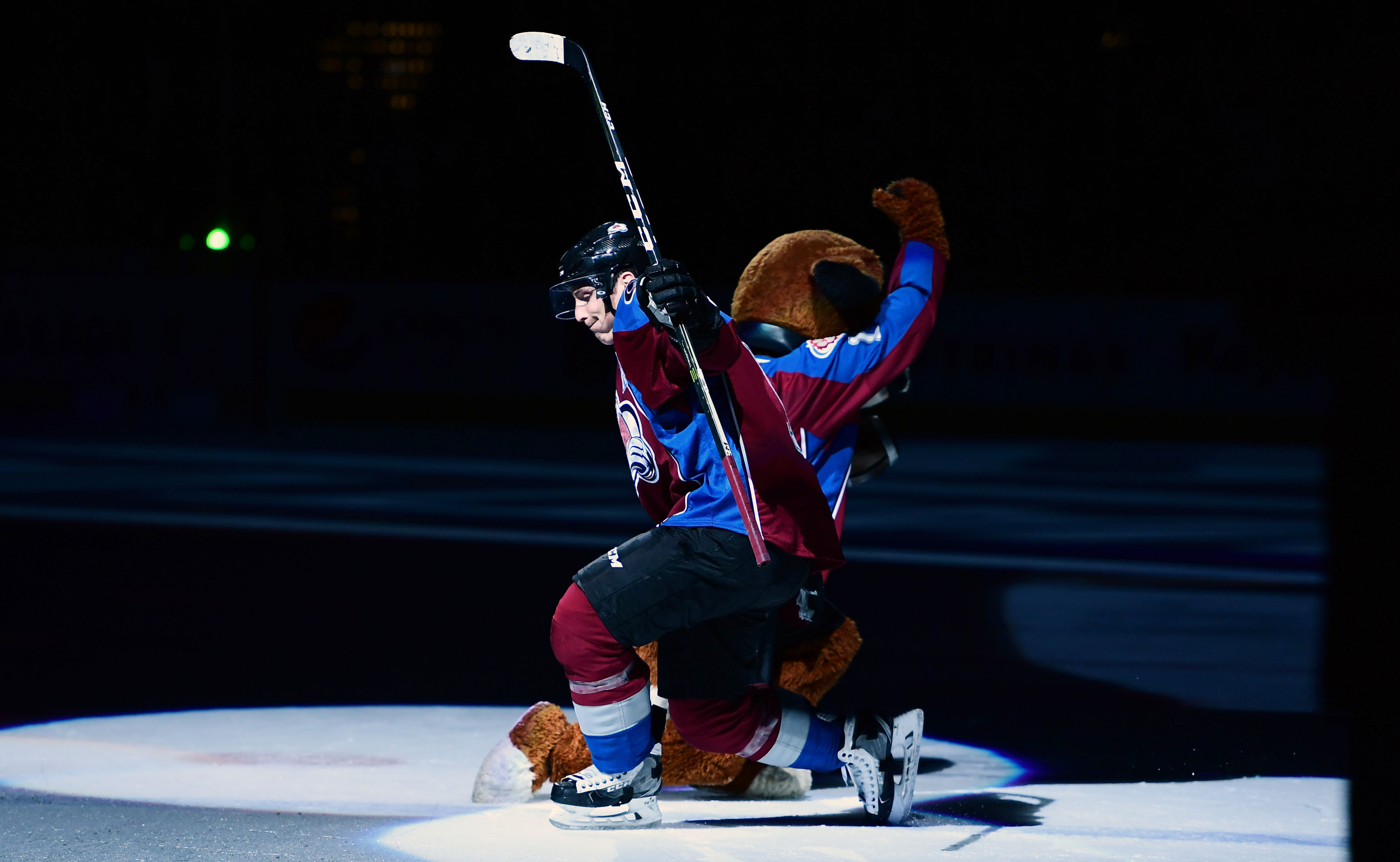 Feb 4, 2017; Denver, CO, USA; Colorado Avalanche center Matt Duchene (9) three star player of the game celebrates with mascot Bernie following the win over the against the Winnipeg Jets at the Pepsi Center. The Avalanche defeated the Jets 5-2. Mandatory Credit: Ron Chenoy-USA TODAY Sports