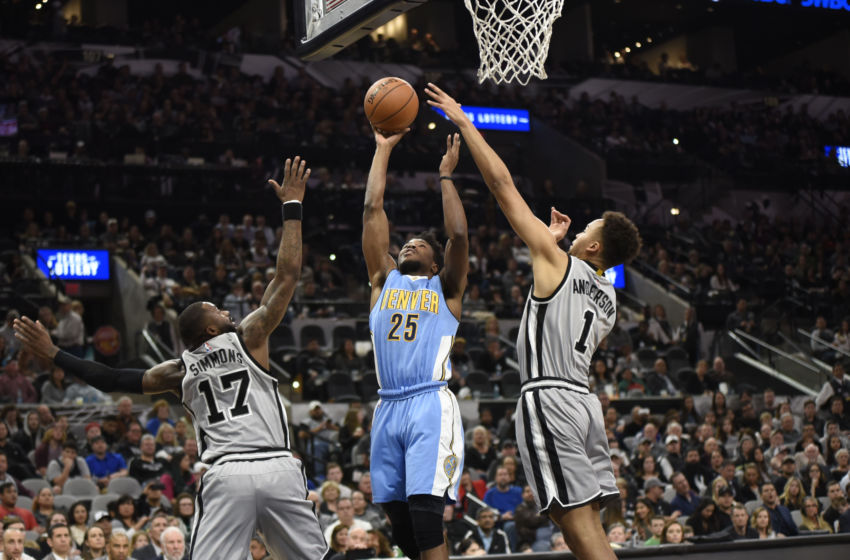 Feb 4, 2017; San Antonio, TX, USA; Denver Nuggets guard Malik Beasley (25) shoots against San Antonio Spurs forward Jonathon Simmons (17) and guard Kyle Anderson (1) during the second half at the AT&T Center. The Spurs won 121-97. Mandatory Credit: Brendan Maloney-USA TODAY Sports