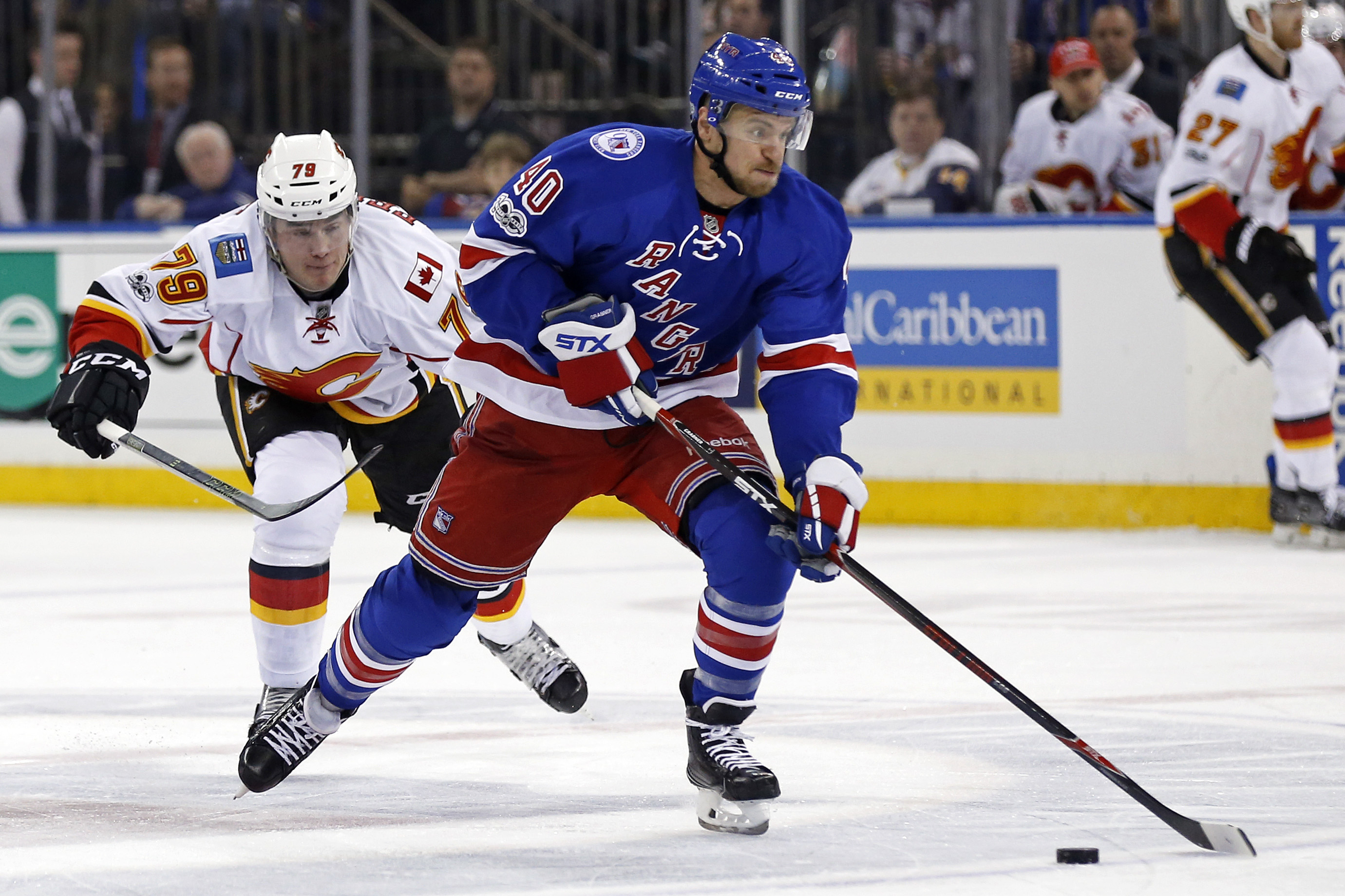 Feb 5, 2017; New York, NY, USA; New York Rangers right wing Michael Grabner (40) controls the puck in front of Calgary Flames left wing Micheal Ferland (79) during the second period at Madison Square Garden. Mandatory Credit: Adam Hunger-USA TODAY Sports
