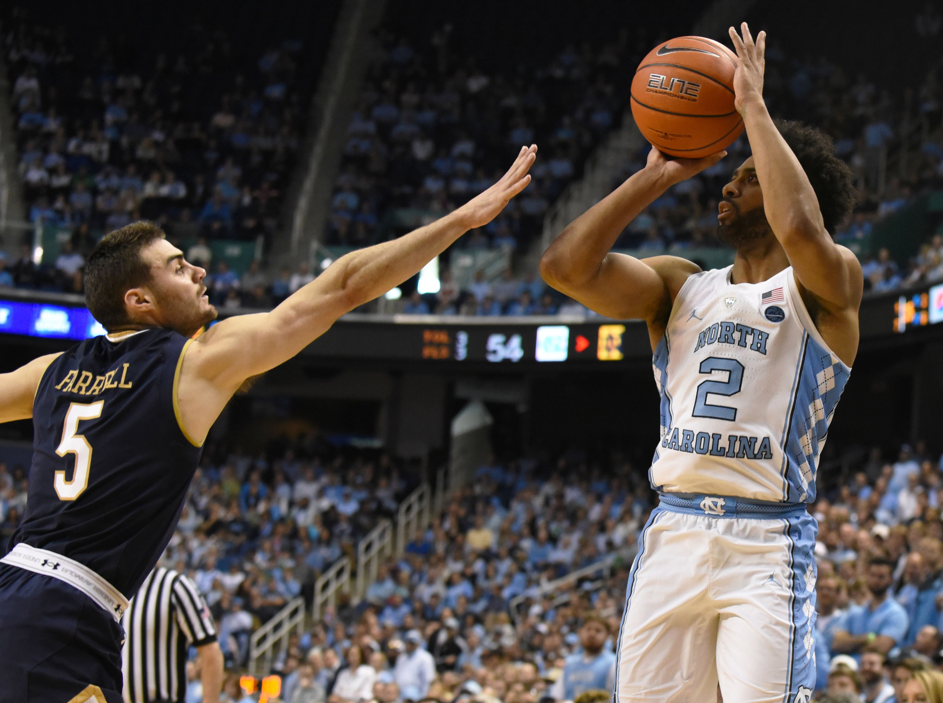 Feb 5, 2017; Greensboro, NC, USA; North Carolina Tar Heels guard Joel Berry II (2) shoots the ball over Notre Dame Fighting Irish guard Matt Farrell (5) during the second half at Greensboro Coliseum. The Tar Heels won 83-76. Mandatory Credit: Rob Kinnan-USA TODAY Sports