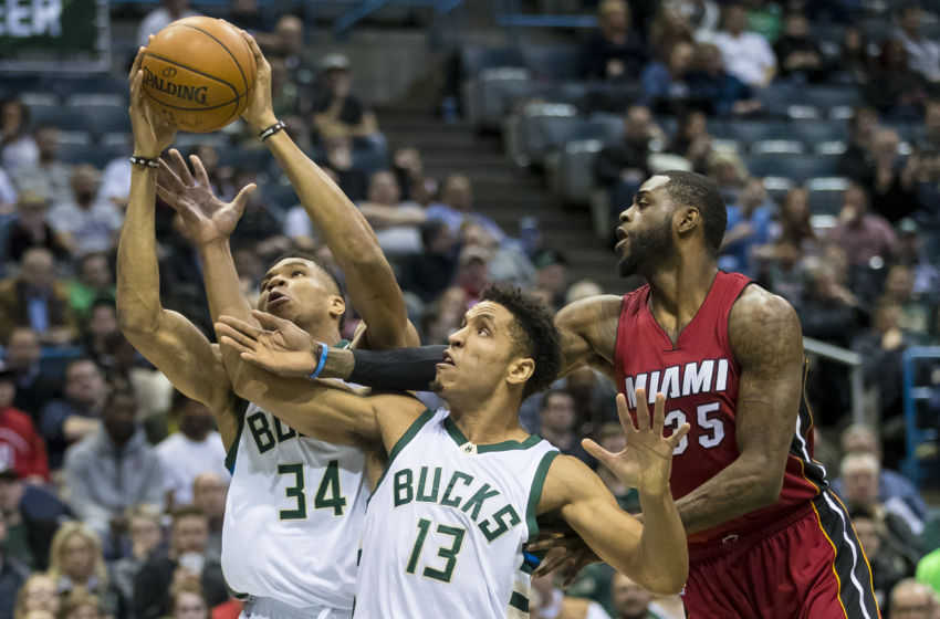 Feb 8, 2017; Milwaukee, WI, USA; Milwaukee Bucks forward Giannis Antetokounmpo (34) and guard Malcolm Brogdon (13) and Miami Heat forward Willie Reed (35) reach for a rebound during the first quarter at BMO Harris Bradley Center. Mandatory Credit: Jeff Hanisch-USA TODAY Sports