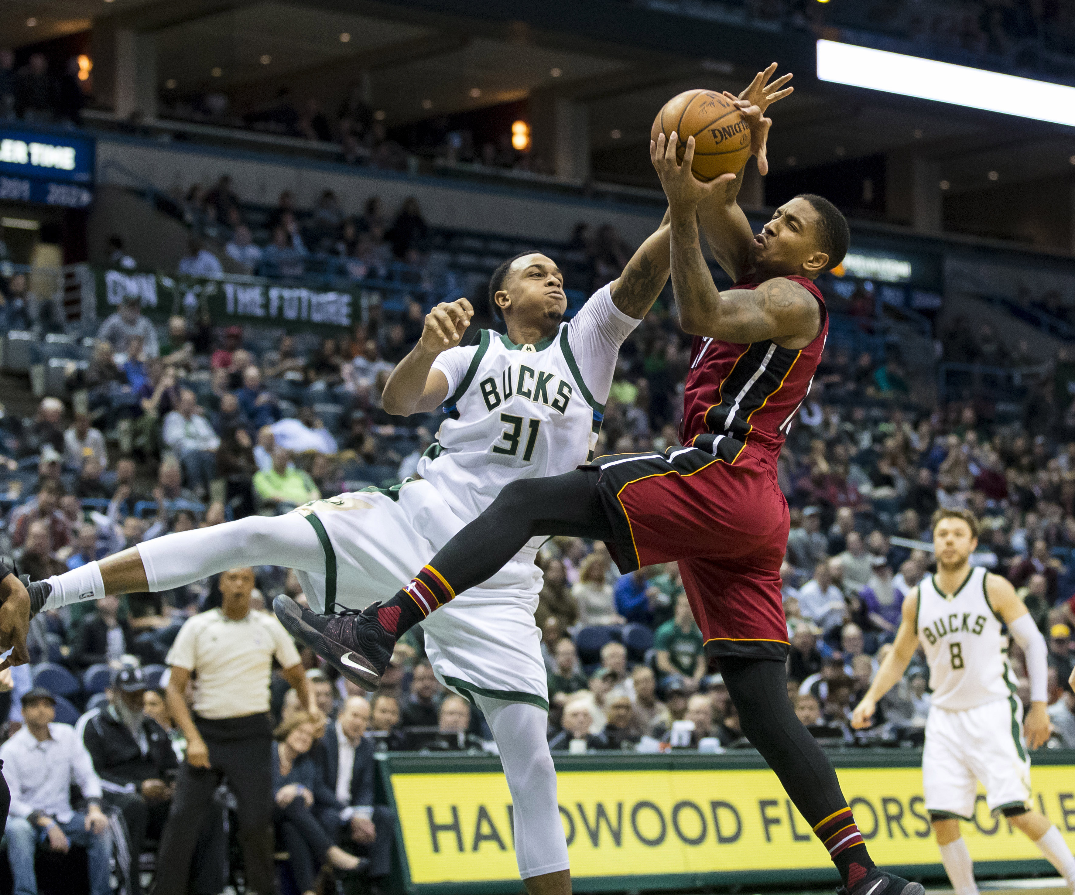 Feb 8, 2017; Milwaukee, WI, USA; Milwaukee Bucks center John Henson (31) and Miami Heat guard Rodney McGruder (17) reach for the ball during the third quarter at BMO Harris Bradley Center. Mandatory Credit: Jeff Hanisch-USA TODAY Sports