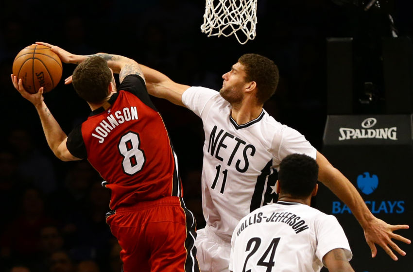Feb 10, 2017; Brooklyn, NY, USA; Brooklyn Nets center Brook Lopez (11) goes up to block a shot by Miami Heat guard Tyler Johnson (8) during the second half at Barclays Center. Maimi won 108-99. Mandatory Credit: Andy Marlin-USA TODAY Sports