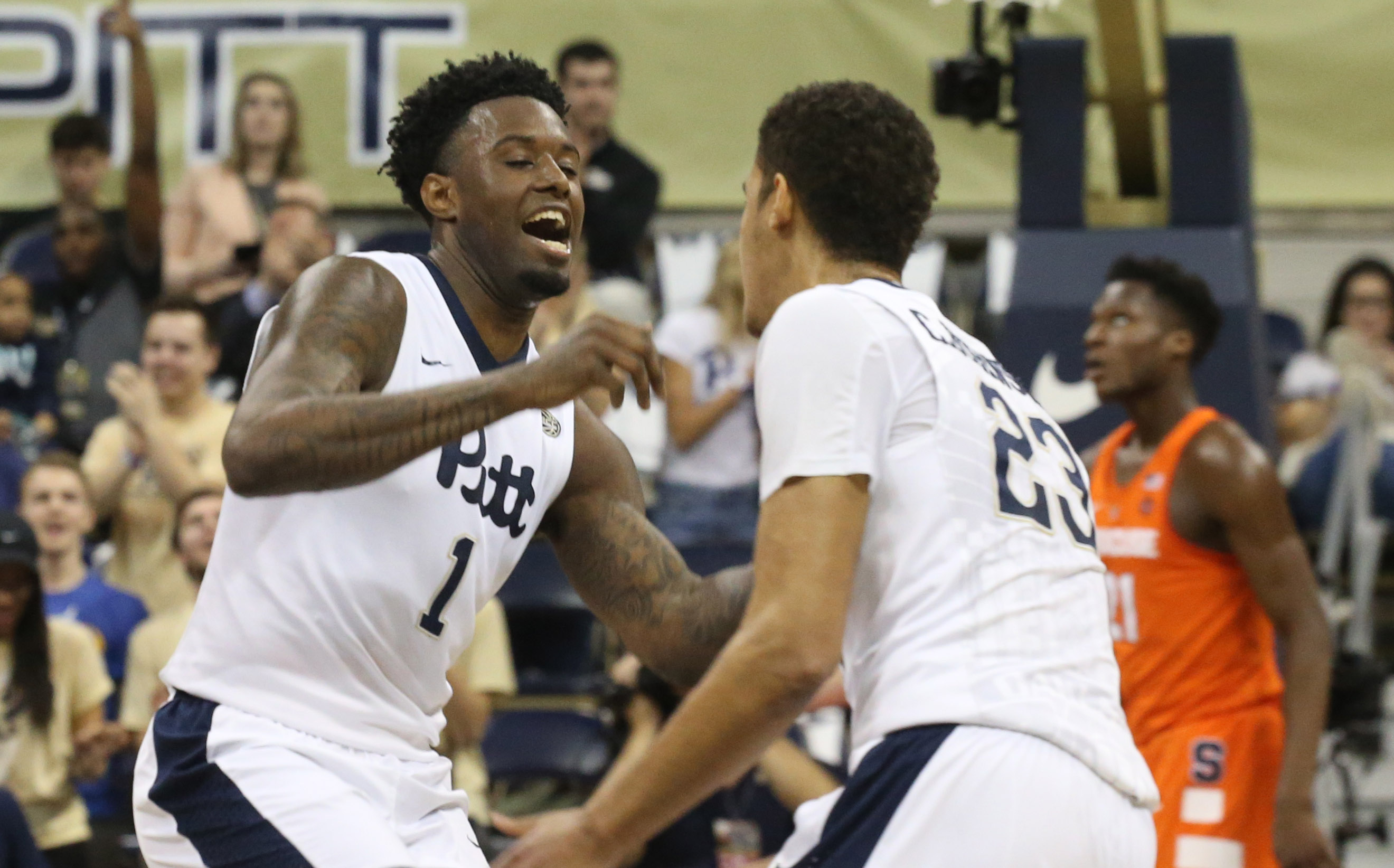 Feb 11, 2017; Pittsburgh, PA, USA; Pittsburgh Panthers forward Jamel Artis (1) and guard Cameron Johnson (23) celebrate a three point basket by Johnson against the Syracuse Orange during the first half at the Petersen Events Center. Pittsburgh won 80-75. Mandatory Credit: Charles LeClaire-USA TODAY Sports