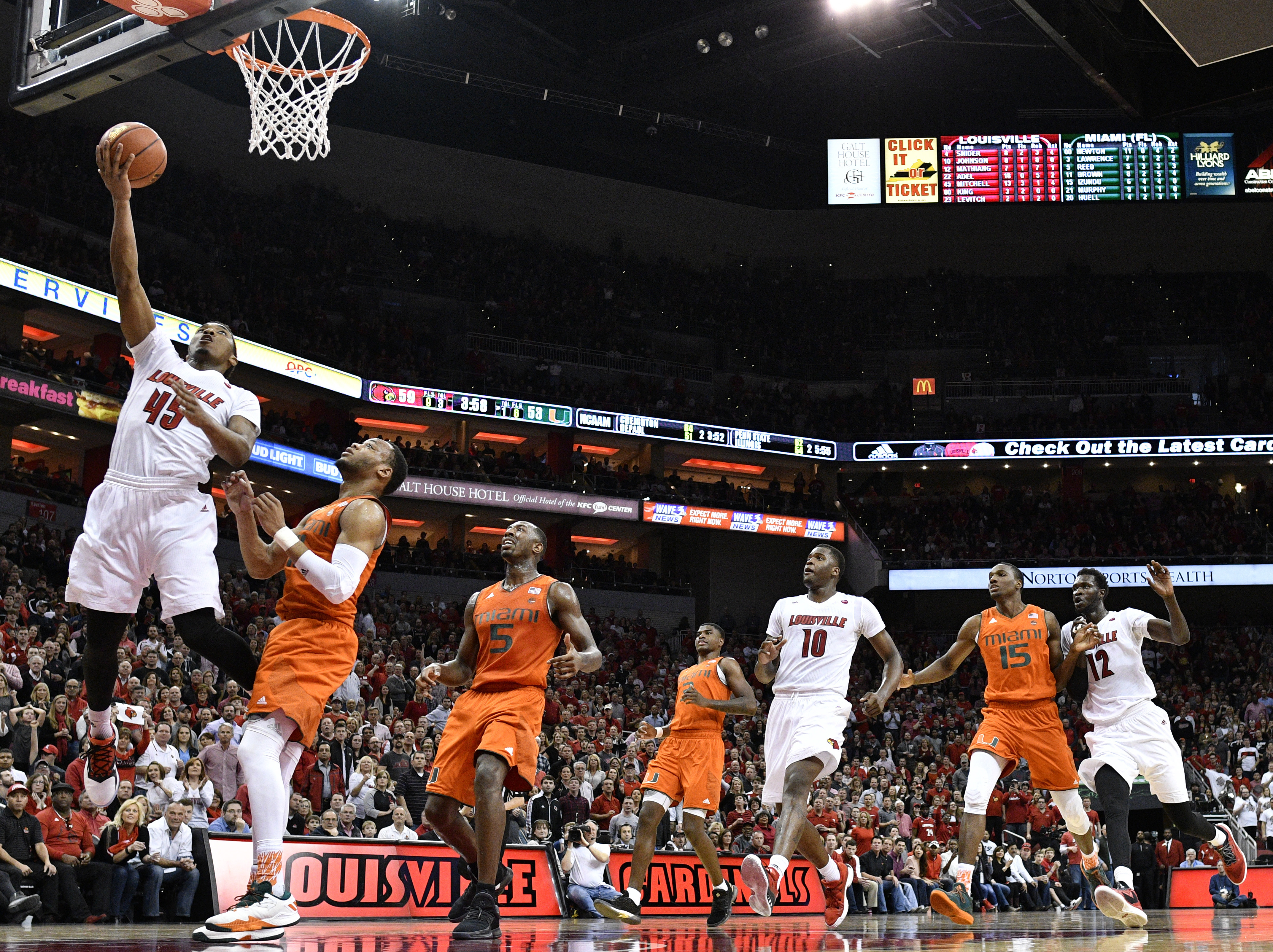Feb 11, 2017; Louisville, KY, USA; Louisville Cardinals guard Donovan Mitchell (45) shoots against Miami (Fl) Hurricanes guard Bruce Brown (11) during the second half at KFC Yum! Center. Louisville defeated Miami 71-66. Mandatory Credit: Jamie Rhodes-USA TODAY Sports