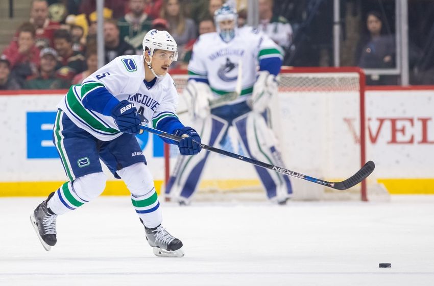 Nov 25, 2015; Saint Paul, MN, USA; Vancouver Canucks defenseman Luca Sbisa (5) passes in the first period against the Minnesota Wild at Xcel Energy Center. Mandatory Credit: Brad Rempel-USA TODAY Sports